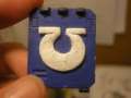 Rhino door embossed with Ultramarine Symbol